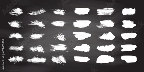 Grunge white brush strokes, paint roller elements on chalkboard background. Set of hand drawn vector  ink splash elements.