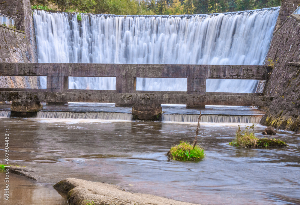 The waterfall called Wiślańska Niagara on the Wisełka river in the Nowa Osada district in the tourist town - Wisła in the Silesian Beskids (Poland).
