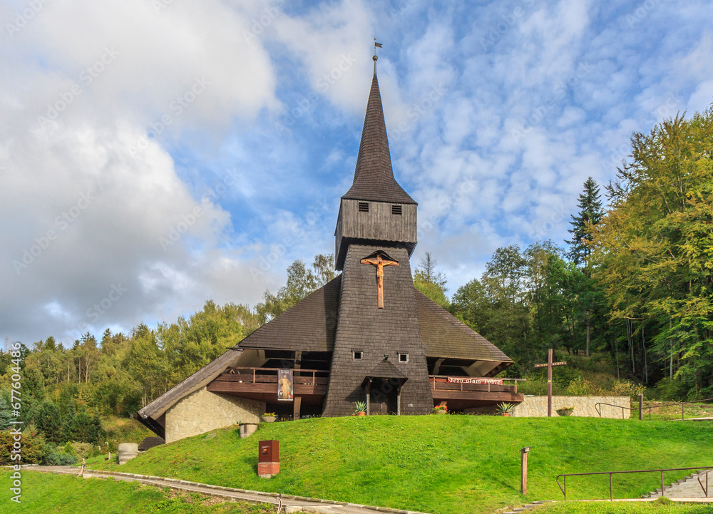 The wooden parish church of the Finding of the Holy Cross in the district Głębce in the tourist town - Wisła in the Silesian Beskids (Poland).