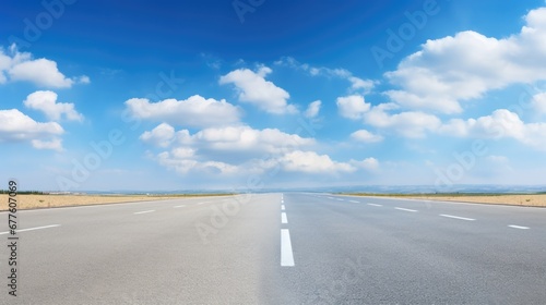 Empty asphalt road and blue sky with white clouds. Road background with blue sky with clouds © GulArt