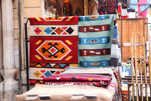 Multicolored carpets on outdoor market on Khan Al-Khalili Bazaar, Cairo, Egypt. Beautiful handmade rugs on the open market bazaar