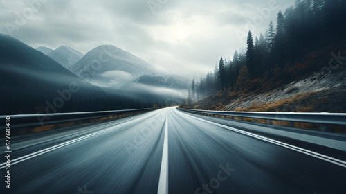 Mountain road descending quickly at high speed photo