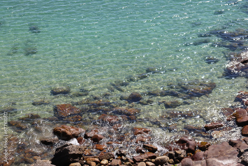 Rocky sea shore with turquoise water