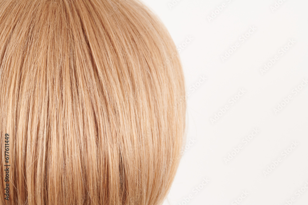 Natural looking shiny hair, fair blonde curls isolated on white background with copy space Natural looking shiny hair, fair blonde curls isolated on white background with copy space