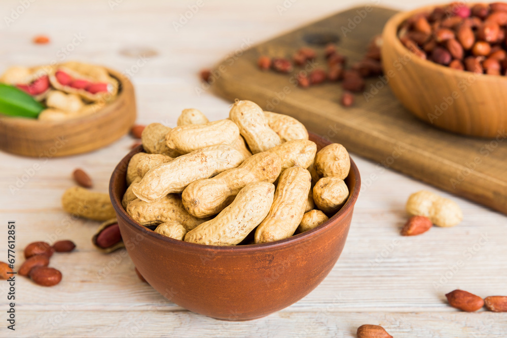 Fresh healthy peanuts in bowl on colored table background. Top view Healthy eating bertholletia concept. Super foods Fresh healthy peanuts in bowl on colored table background. Top view Healthy eating bertholletia concept. Super foods