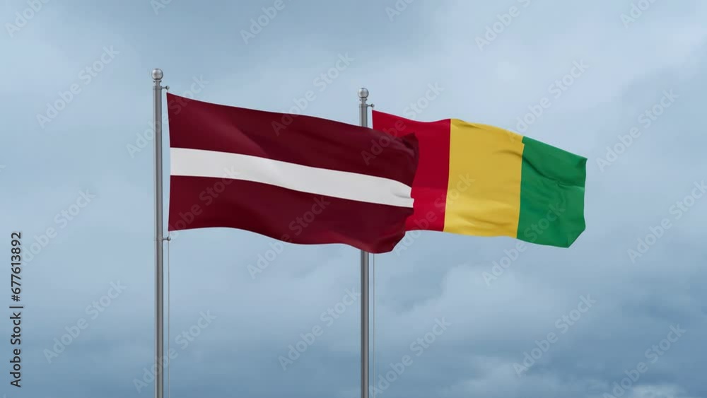 Republic of Guinea flag and Latvia flag waving together on cloudy sky, endless seamless loop, two country relations concept Republic of Guinea flag and Latvia flag waving together on cloudy sky, endless seamless loop, two country relations concept
