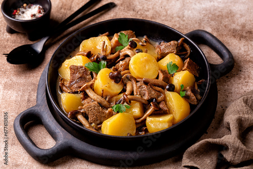Hearty and comforting Beef and Poplar Mushroom Stew with potatoes and wine. Rustic style.