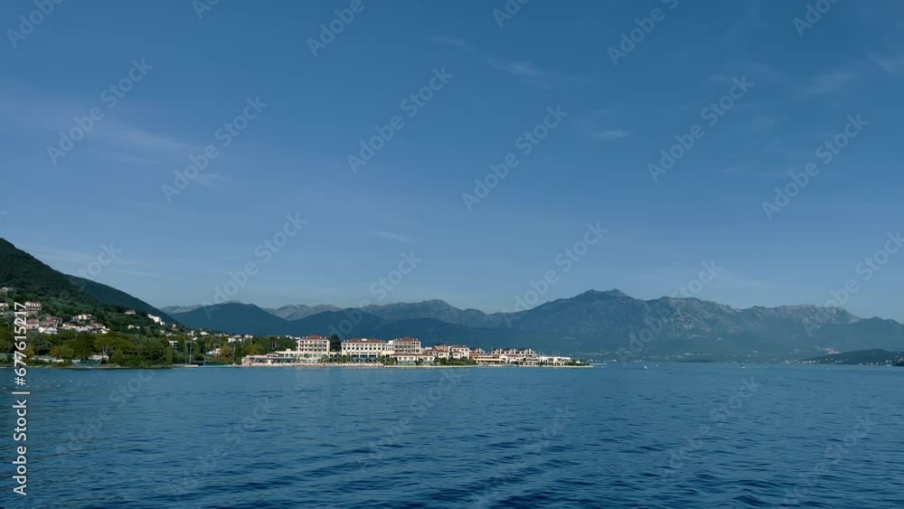 A walk along the Mediterranean Sea during a summer vacation. Marina surrounded by mountains in Porto Novi A walk along the Mediterranean Sea during a summer vacation. Marina surrounded by mountains in Porto Novi
