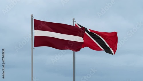 Wallpaper Mural Trinidad and Tobago and Latvia flag waving together on cloudy sky, endless seamless loop, two country cooperation concept Torontodigital.ca