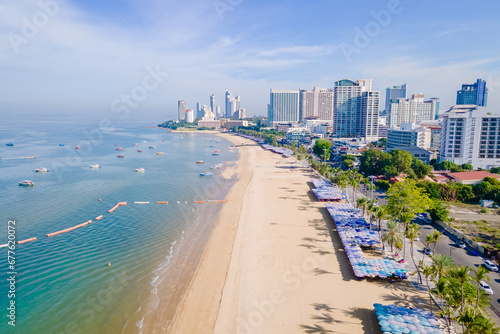 Pattaya Thailand, a view of the beach road with hotels palm trees and skyscrapers buildings alongside the renovated new beach road on a sunny day © Fokke Baarssen