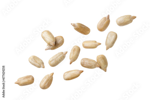 Sunflower seed kernels fly on a white background. Isolated photo