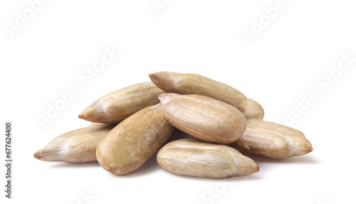 Pile of peeled sunflower seeds close-up on a white background. Isolated