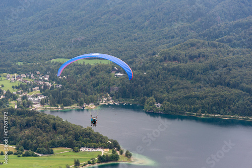 Beautiful landcape near Lake Bohinj in northern Slovenia near Austria in the Julian Alps with parachutist