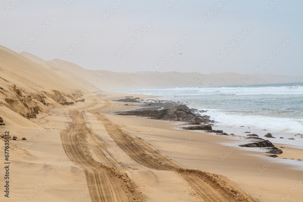 Off road track that runs along the ocean in Walvis bay, Namibia Off road track that runs along the ocean in Walvis bay, Namibia