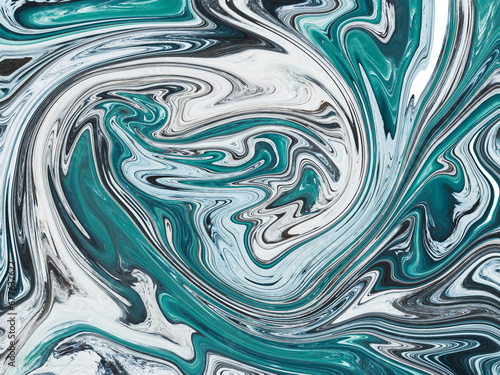 An abstract image of swirling blue, white, and black colors, giving a sense of movement, flow, depth, and texture, resembling a close-up of a fluid or liquid