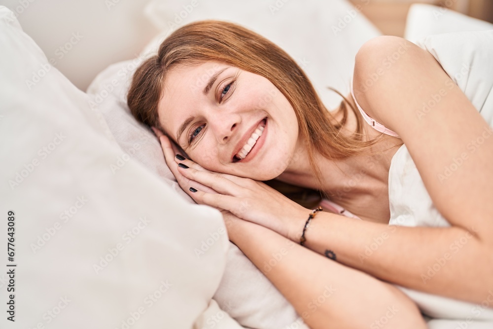 Young blonde woman smiling confident lying on bed at bedroom Young blonde woman smiling confident lying on bed at bedroom
