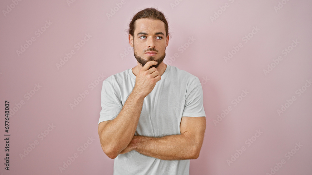 Young hispanic man standing with doubt expression over isolated pink background Young hispanic man standing with doubt expression over isolated pink background