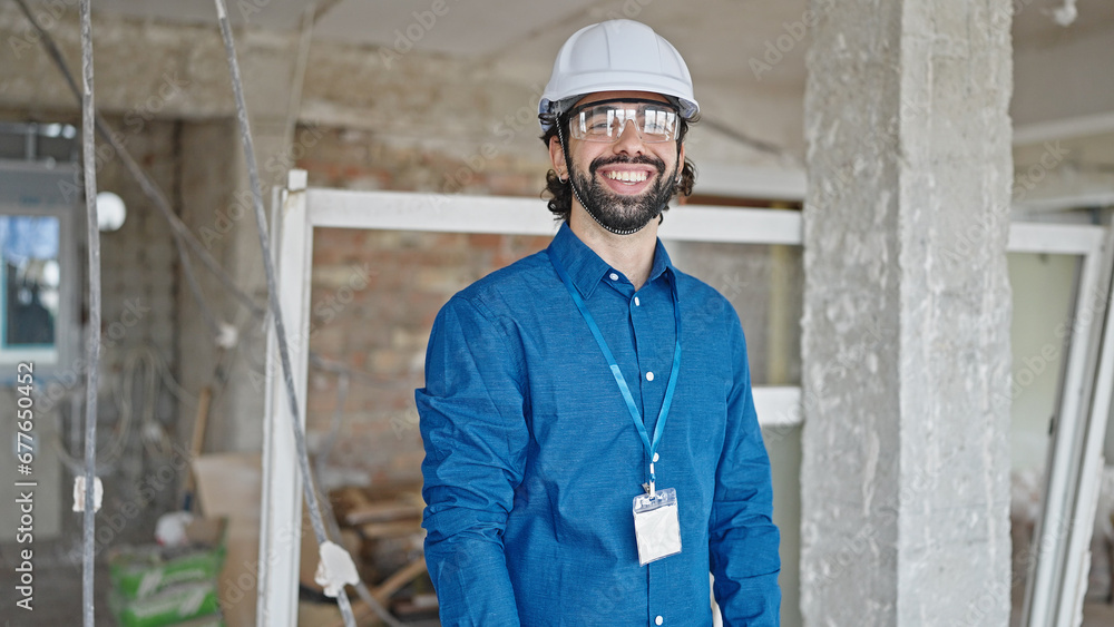 Young hispanic man architect smiling confident standing at construction site Young hispanic man architect smiling confident standing at construction site