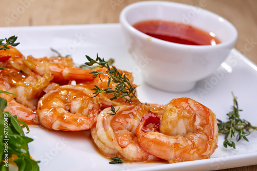 shrimps with sauce on white plate