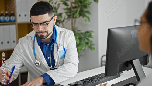 In the heart of healthcare, concentrated doctor and patient working together, writing noteworthy medical report at the clinic