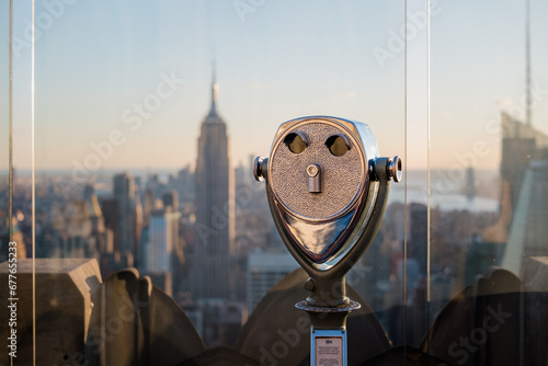 Binoculars on top of the Rockefeller Center overlooking Manhattan and New York City