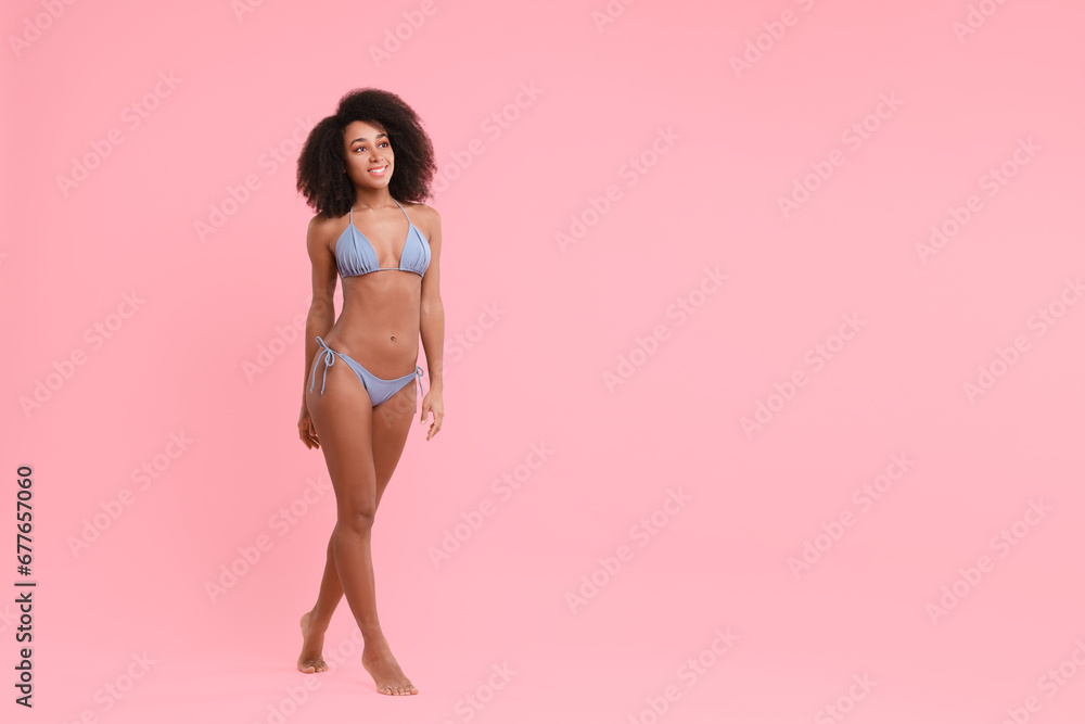 Beautiful woman in stylish bikini on pink background, space for text Beautiful woman in stylish bikini on pink background, space for text