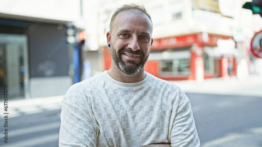 Cool, confident young man standing on street, smiling with joy - a glimpse of urban lifestyle, handsome caucasian adult embodying confidence, happiness and positivity, enjoying his city life. Cool, confident young man standing on street, smiling with joy - a glimpse of urban lifestyle, handsome caucasian adult embodying confidence, happiness and positivity, enjoying his city life.