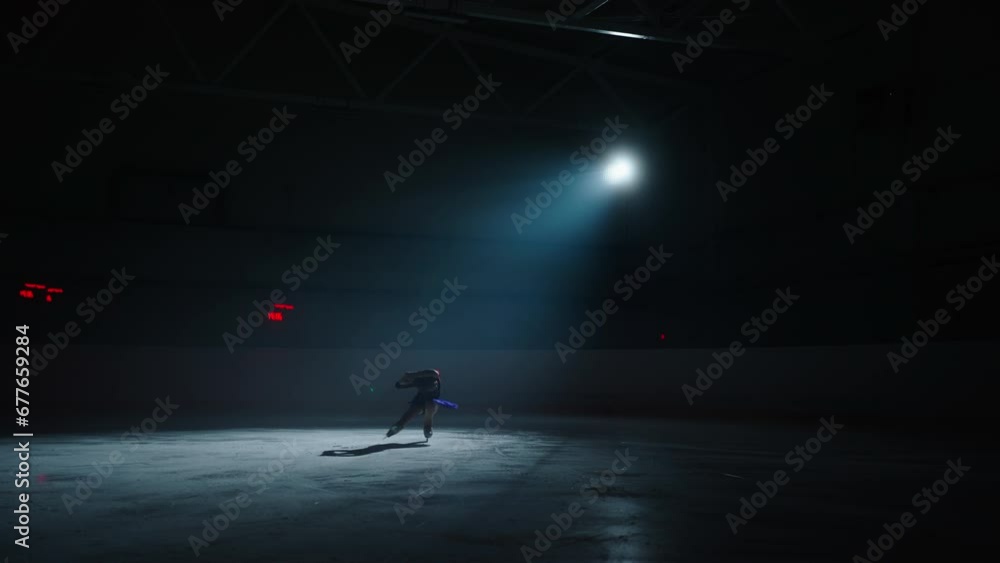 Little Girl Figure Skater Training And Rehearsing In Ice Rink In Night, Preparing To Competition Little Girl Figure Skater Training And Rehearsing In Ice Rink In Night, Preparing To Competition