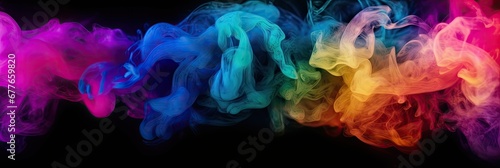 Abstract colorful smoke on isolated black background.