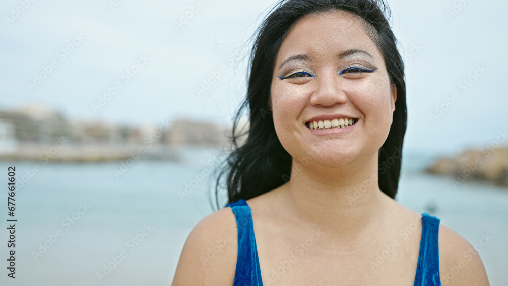 Young chinese woman tourist smiling confident wearing bikini at the beach Young chinese woman tourist smiling confident wearing bikini at the beach