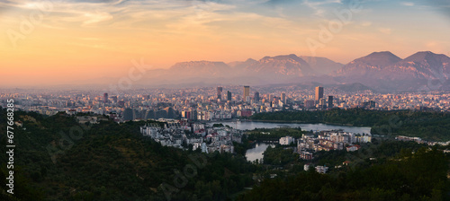 Aerial panorama view of Tirana at sunset, the capital city in Albania.