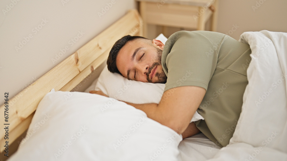 Young hispanic man lying on bed sleeping at bedroom Young hispanic man lying on bed sleeping at bedroom