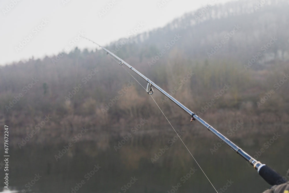 Fishing on the lake at sunse.spinning fishing.