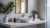 Wall-mounted vanity with white ceramic vessel sink. Interior design of modern scandinavian bathroom
