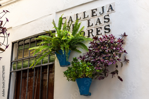 Calleja de las Flores, sign with the name of the famous street in ceramic tiles, Cordoba. photo