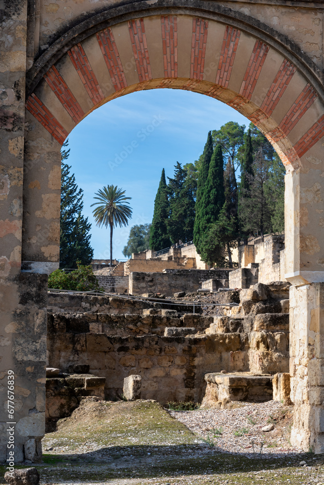 Door in a semicircular arch in the palatine city of Madinat Al-zahra, in Spanish Medina Azahara, archaeological site in Cordoba, Andalusia.