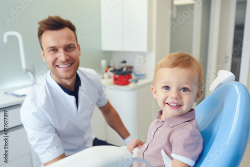 Smiling doctor or pediatrician holding a baby 