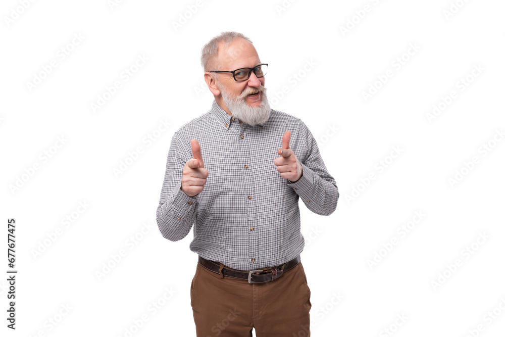 Naklejka premium a handsome old man with a mustache and a beard in glasses is dressed in a shirt and trousers on a white background