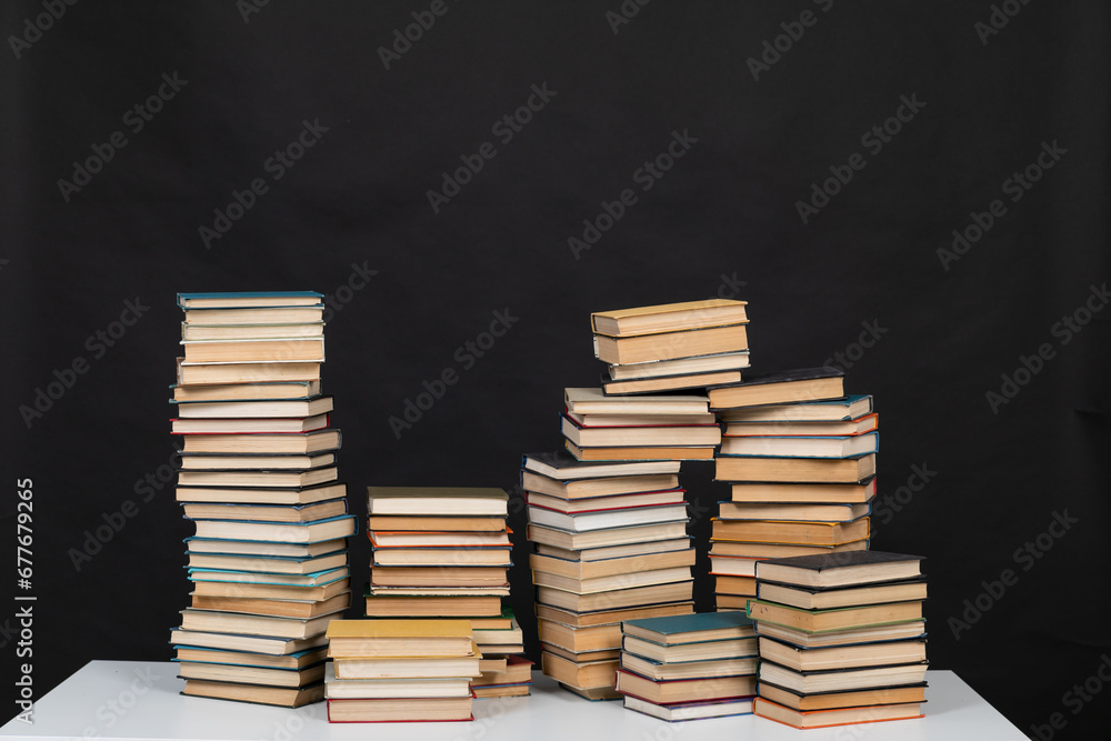learning library science stack of books on a black background learning library science stack of books on a black background