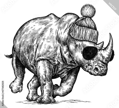 Vintage engraving isolated rhinoceros glasses dressed fashion set illustration ink sketch. Africa background rhino silhouette sunglasses hipster hat art. Black and white hand drawn vector image