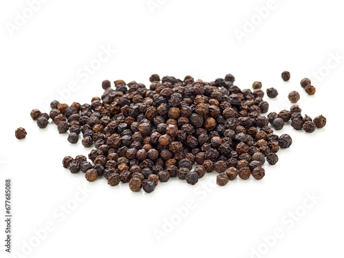 pile of black pepper seeds isolated on white background