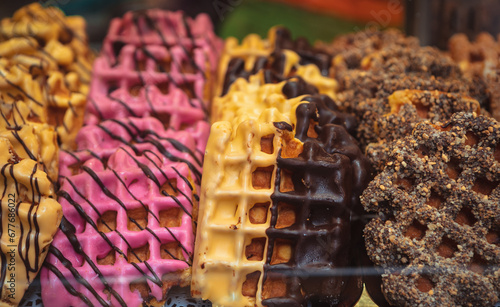 Photography Colorful waffles glazed with chocolate