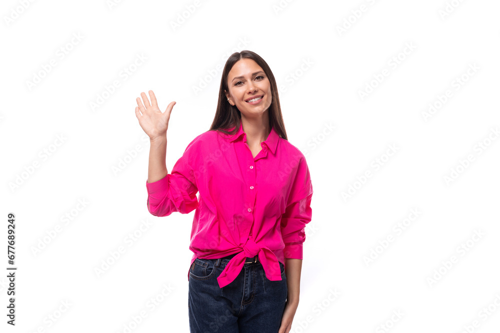 young confident strong brunette woman leader wears a bright pink shirt on a white background young confident strong brunette woman leader wears a bright pink shirt on a white background