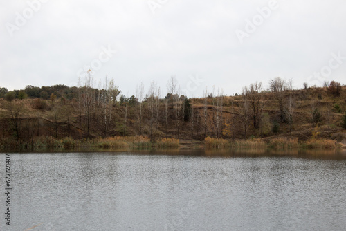 Panorama of the lake in autumn. Claudy day in nature.