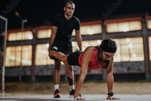 Evening Workout: Fit Couple Exercising in Park
