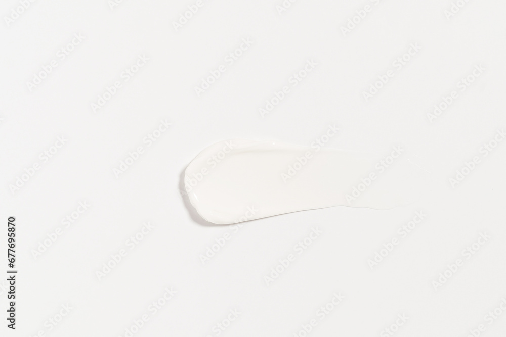 texture of a white smear of cream on an isolated background. concept of beauty products for moisturizing and skin care texture of a white smear of cream on an isolated background. concept of beauty products for moisturizing and skin care