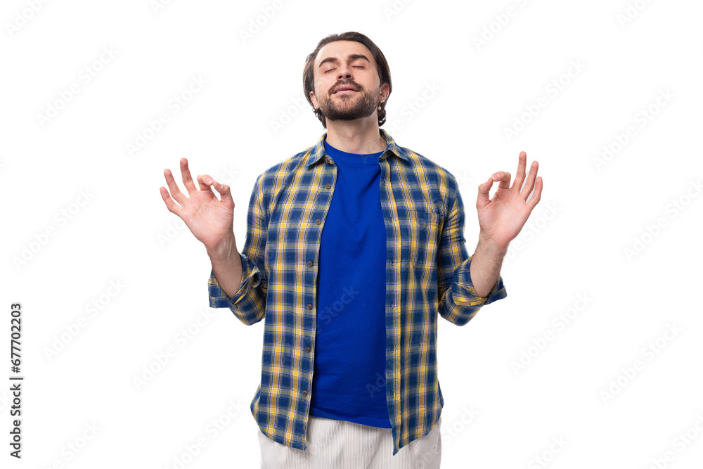 portrait of a pleasant calm young european brunette with a beard dressed stylishly in a shirt portrait of a pleasant calm young european brunette with a beard dressed stylishly in a shirt