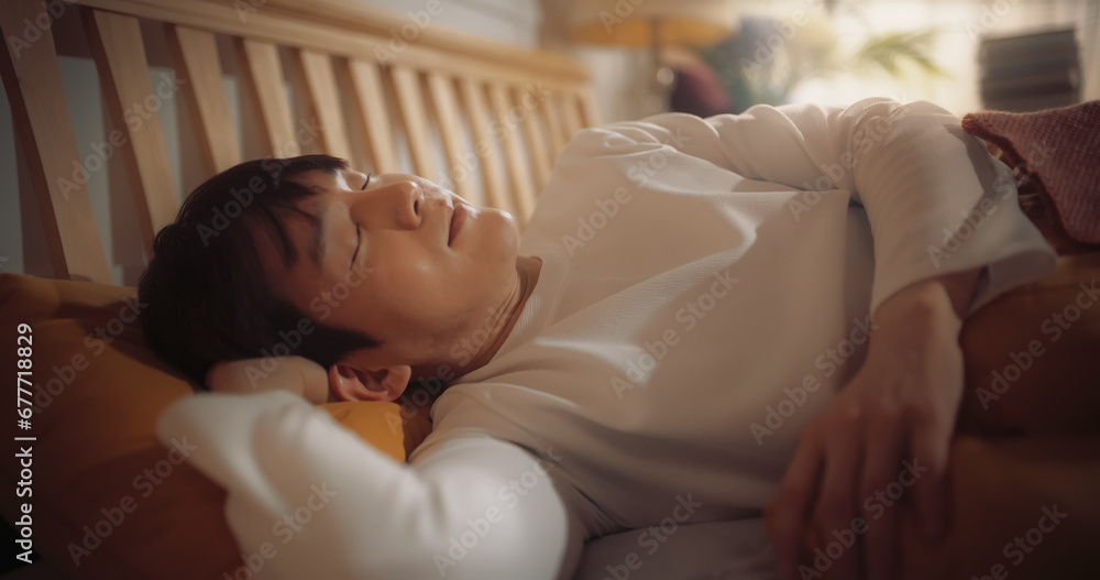 Portrait of Handsome Korean Young Man Getting Awaken by the Sun Shining Through his Window. Happy Asian Male Greets a New Sunny Day in his Bed, Feeling Thankful for all his Blessings Portrait of Handsome Korean Young Man Getting Awaken by the Sun Shining Through his Window. Happy Asian Male Greets a New Sunny Day in his Bed, Feeling Thankful for all his Blessings