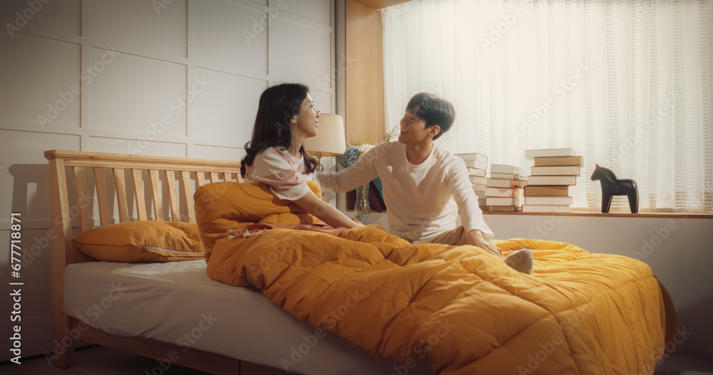 Beautiful Young Korean Couple Sleeping in Bed, Sun Shines on Them, They Look at Each Other and Greet New Sunny Day. Joyful Waking Up of Family of Two, Enjoying the Warmth of the Sun and Their Love Beautiful Young Korean Couple Sleeping in Bed, Sun Shines on Them, They Look at Each Other and Greet New Sunny Day. Joyful Waking Up of Family of Two, Enjoying the Warmth of the Sun and Their Love