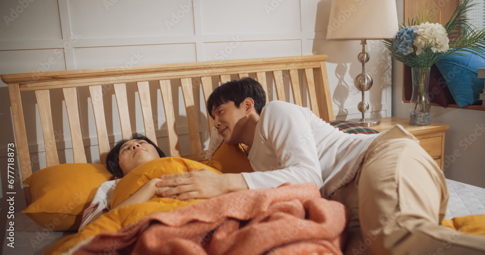 Beautiful Young Korean Couple Sleeping in Bed, Caring Husband Waking up